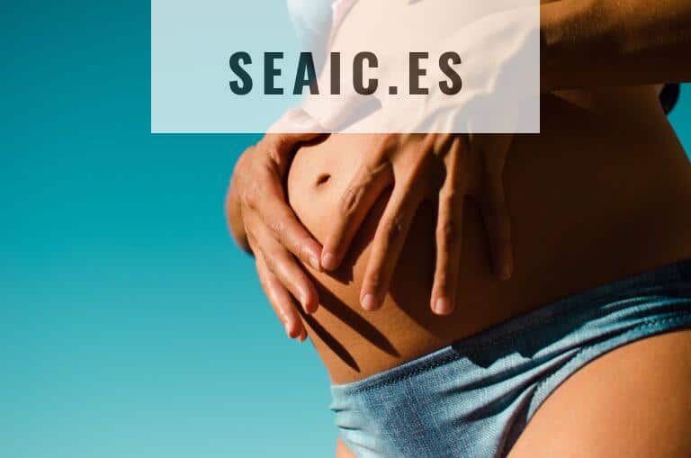 closeup photography of pregnant woman wearing blue panty